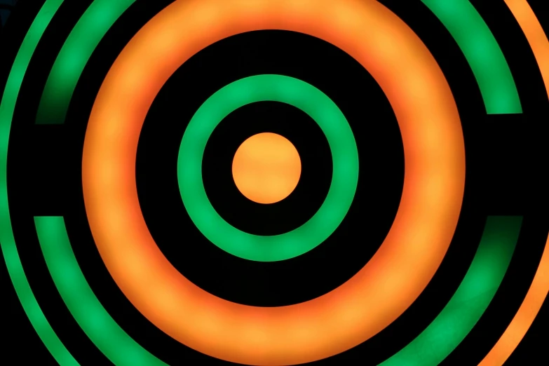 a black background with green, orange and yellow circles, by Doug Ohlson, concentric circles, sun at dawn, dart board, orange