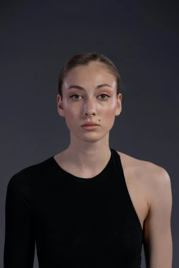 a woman in a black top posing for a picture, a character portrait, inspired by Elizabeth Polunin, trending on pexels, hyperrealism, thin face structure, bella poarch, integrated synthetic android, photoscanned