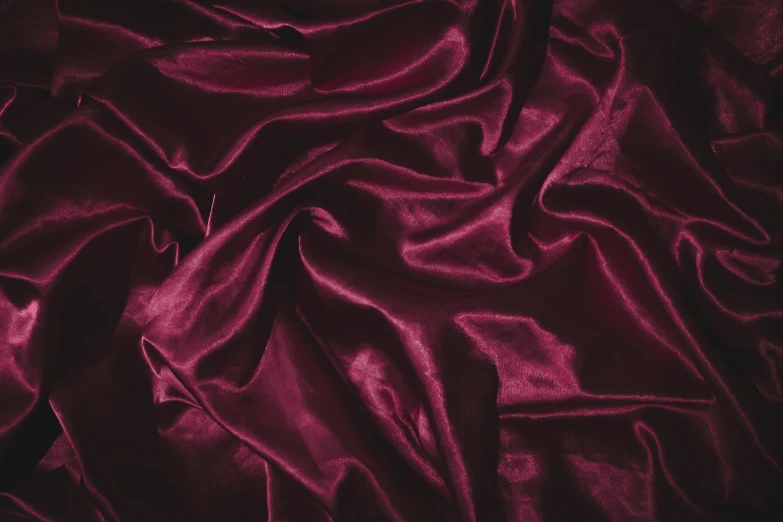 a close up of a red cloth on a bed, trending on pexels, baroque, ((purple)), grape, satin, oceanside