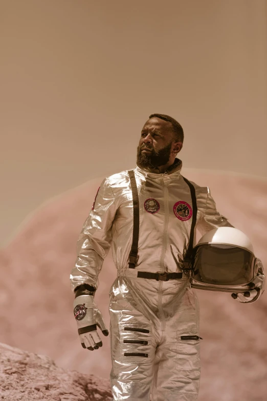 a close up of a person in a space suit, an album cover, inspired by ridley scott, trending on unsplash, afrofuturism, the last man on earth, realistic movie still, mars vacation photo, scene from live action movie