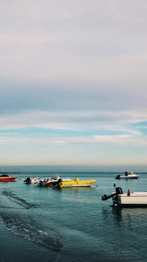 a number of boats on a body of water, unsplash, low quality photo, south african coast, thumbnail, multiple stories