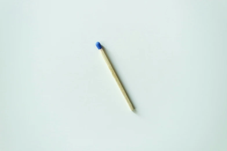 a close up of a matchstick on a white surface, a picture, kobalt blue, item, nakolki, small