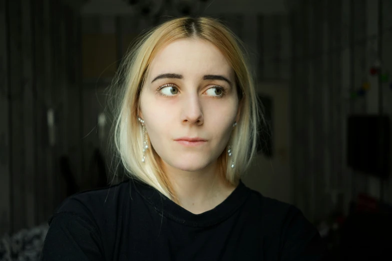 a close up of a person wearing a black shirt, a character portrait, inspired by Elsa Bleda, featured on reddit, pale hair, perfect face ), sofya emelenko, without makeup
