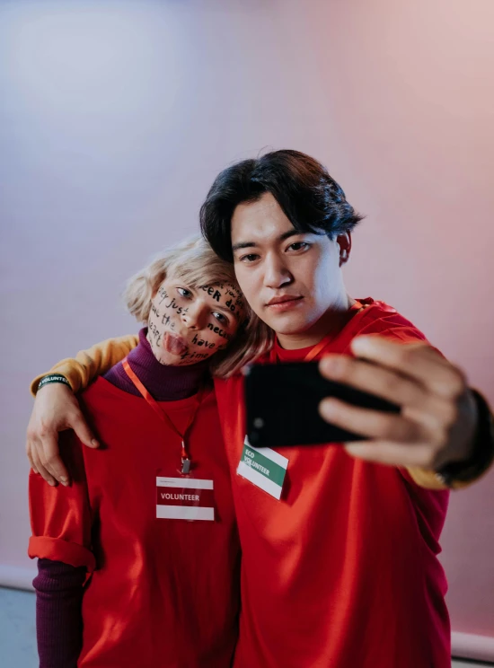 a man and a woman taking a selfie, a picture, by Jang Seung-eop, trending on pexels, realism, cosplayer dressed like a crab, chucky style, all from the group nct, human face with bright red yes