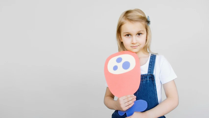 a little girl holding a heart shaped balloon, by Paul Bird, pexels contest winner, pop art, papercraft, holding a snowboard, product introduction photo, pancake short large head