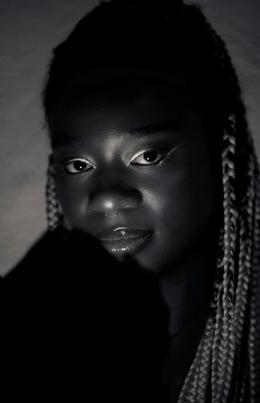 a close up of a person with long hair, a black and white photo, inspired by Theo Constanté, unsplash, afrofuturism, glowing with silver light, black teenage girl, low quality footage, ( ( dark skin ) )