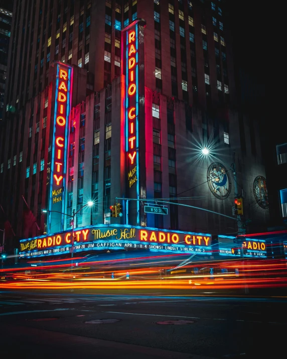 the radio city radio city building lit up at night, a picture, pexels contest winner, album art, color image, desaturated, 2 0 2 2 photo