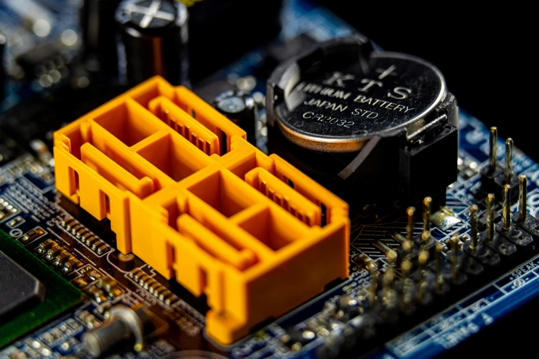 a close up of a computer mother board, by Jason Felix, unsplash, black and yellow scheme, 3 d print, battery, crypto