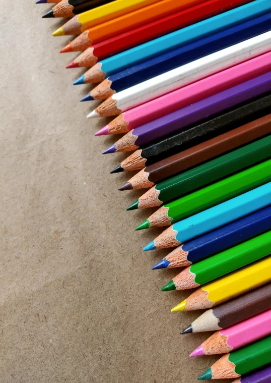 a row of colored pencils sitting on top of a table, cobalt coloration, on medium grade paper, art bundle, multicolor