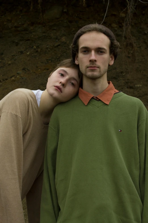 a man and a woman standing next to each other, an album cover, by Attila Meszlenyi, unsplash, renaissance, wearing a green sweater, 1996), teenagers, color photograph portrait 4k