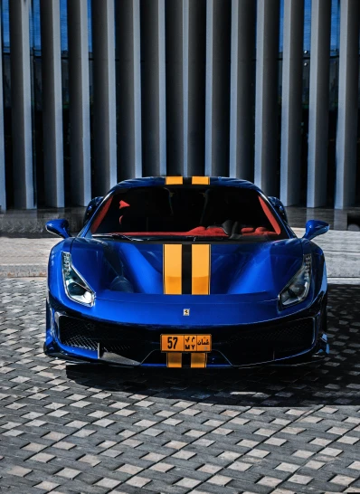 a blue sports car parked in front of a building, orange racing stripes, ferrari logo on it's chest, thumbnail, taken with sony alpha 9