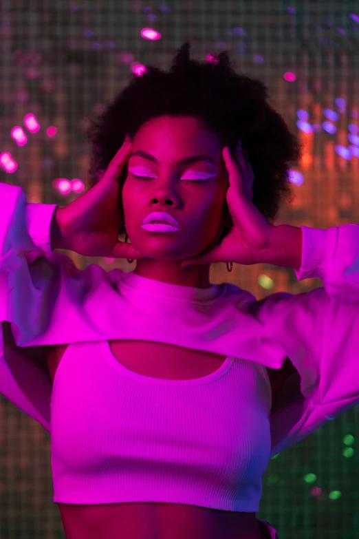 a woman with her hands on her head, by Peter Alexander Hay, trending on pexels, afrofuturism, pink lighting, photo of a model, nightlife, like a catalog photograph