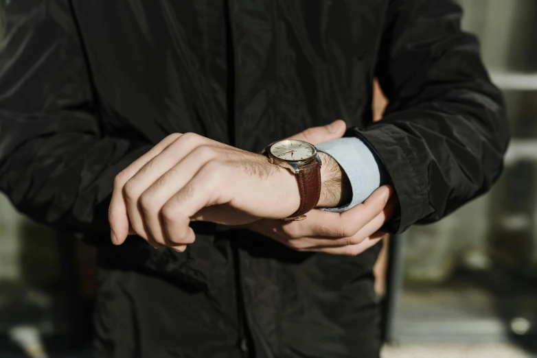 a close up of a person wearing a watch, inspired by Harrington Mann, wearing a brown leather coat, thumbnail, al fresco, architect