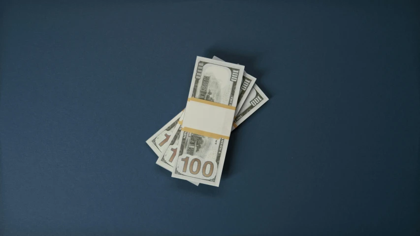 a bunch of money sitting on top of a table, with a blue background, product image, high res 8k, straight camera view