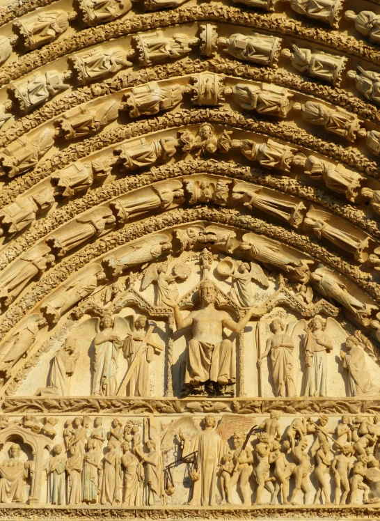 a close up of a building with carvings on it, an album cover, romanesque, sculptures, cathedral of sun, 4k”, lots de details