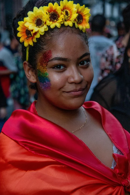 a woman in a red dress with sunflowers on her head, by Sam Dillemans, pexels, renaissance, pride parade, wearing rainbow kimono, teenage girl, alanis guillen