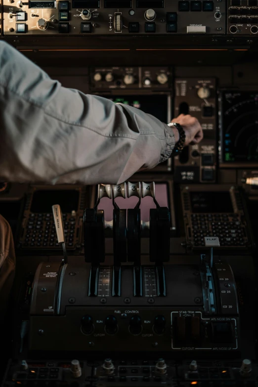 a man that is sitting in the cockpit of a plane, pexels contest winner, happening, hands on counter, slightly pixelated, predawn, ( mechanical )