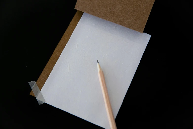 a pencil sitting on top of a piece of paper, private press, standing with a black background, white sketchbook style, material pack, product introduction photo