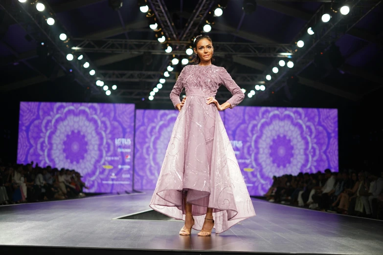 a woman in a purple dress walking down a runway, ameera al-taweel, nivanh chanthara, thumbnail, lilac