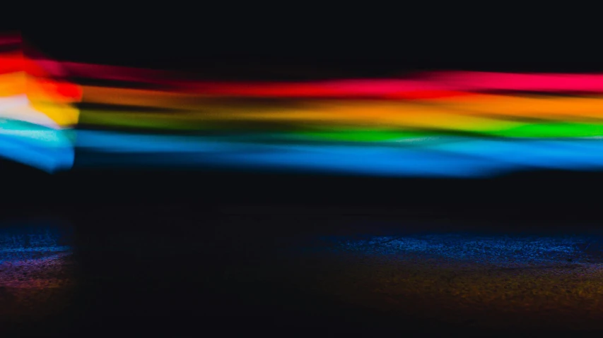 a blurry photo of a person holding an umbrella, a hologram, by Thomas Häfner, unsplash, color field, rainbow neon strips, nightime long exposure, rainbow road, on a gray background