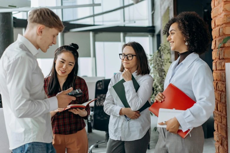 a group of young people standing next to each other, a cartoon, trending on pexels, sat in an office, avatar image, healthcare, mid shot photo