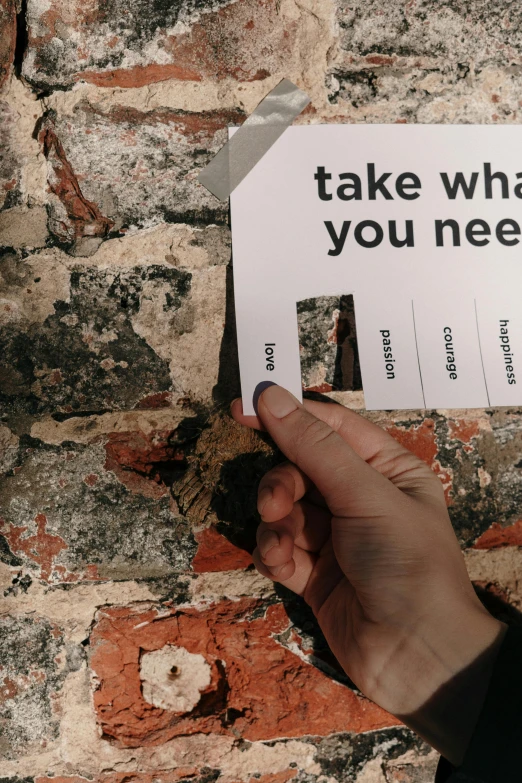 a person holding a piece of paper that says take what you need, pexels contest winner, conceptual art, broken tiles, labels, tall, lgbtq