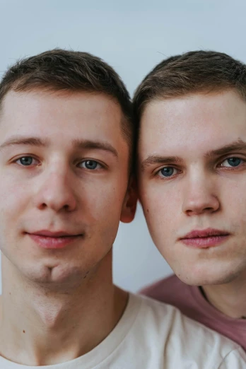 a couple of men standing next to each other, by Attila Meszlenyi, reddit, close - up studio photo, 18 years old, clean - shaven, 15081959 21121991 01012000 4k