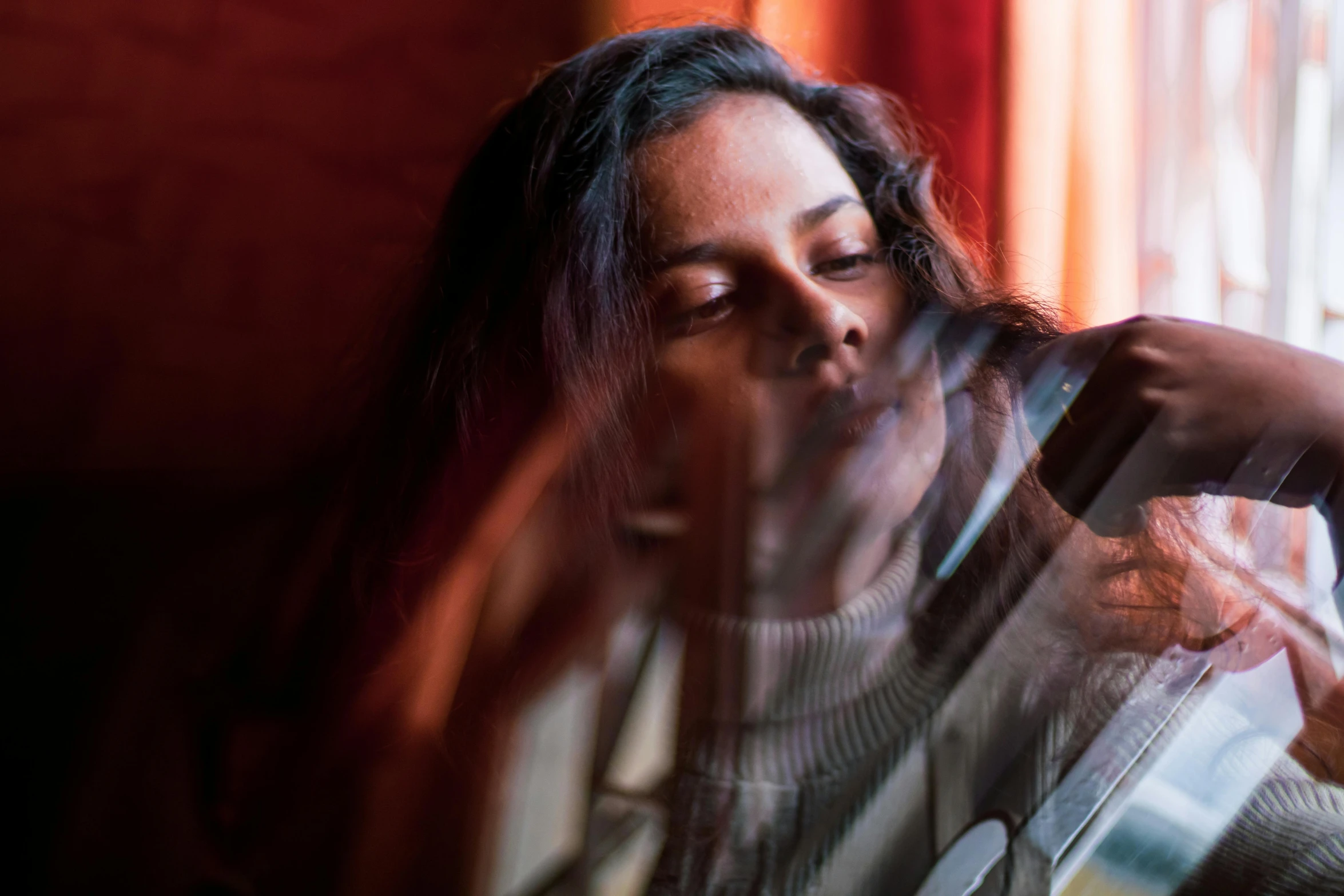 a woman playing a guitar in front of a window, an album cover, pexels contest winner, ritu kumar, looking into a mirror, dafne keen, cinematic light and reflections