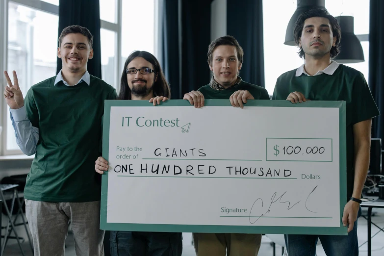 a group of men standing next to each other holding a check, pexels contest winner, computer art, giant screens, it specialist, ignant, portraiit
