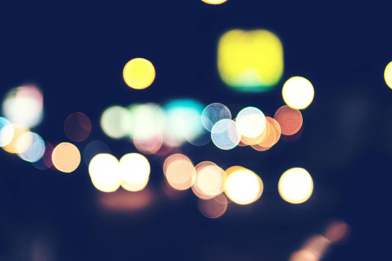 a blurry photo of a city street at night, by Niko Henrichon, unsplash, happening, macro bokeh ”, retro lights, overcast bokeh - c 5, multicoloured