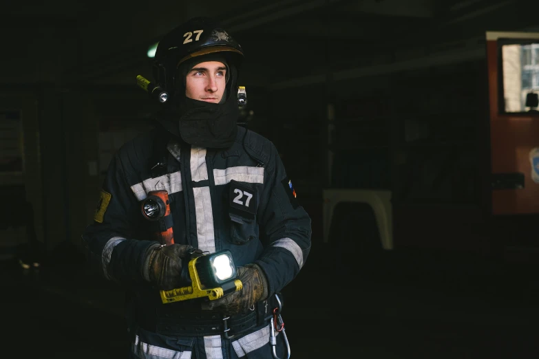 a firefighter standing in a garage holding a flashlight, a portrait, by Adam Marczyński, figuration libre, worksafe. instagram photo, caucasian, white helmet, age 2 0