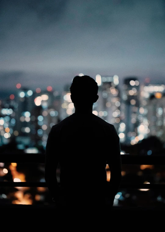 a man standing in front of a city at night, profile image, leaked photo, fan favorite, towering over your view
