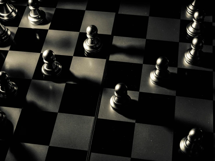 a black and white chess board with chess pieces, by Jesper Knudsen, unsplash, precisionism, strong shadows), random positions floating, highly symmetrical, board games on a table