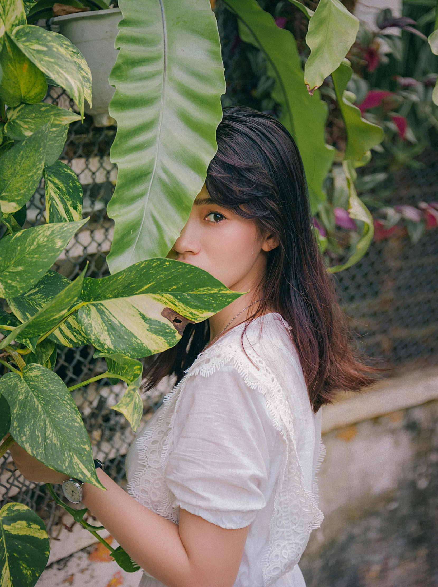 a woman standing in front of a bunch of plants, by Tan Ting-pho, unsplash, visual art, 🤤 girl portrait, ulzzang, lush foliage, hwang se - on