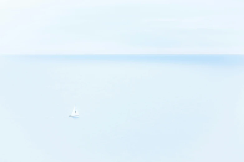 a boat floating in the middle of a large body of water, inspired by Jan Rustem, unsplash contest winner, minimalism, white and pale blue toned, sailboat, ignant, minor blur