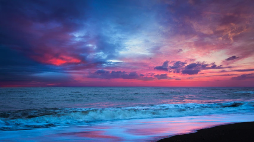 a pink and blue sunset over the ocean, an album cover, inspired by Edwin Deakin, pexels contest winner, black sand, vibrant vivid colors, magenta and blue, sunset panorama