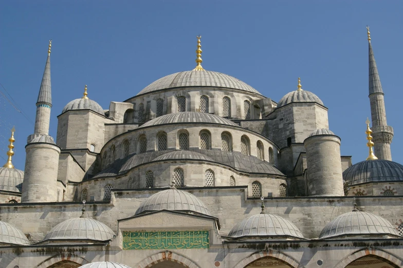 a group of people standing in front of a large building, inspired by Osman Hamdi Bey, pexels contest winner, hurufiyya, dome, blue gray, 2 5 6 x 2 5 6 pixels, snail