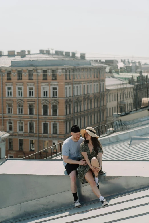 a man and a woman sitting on top of a building, by Serhii Vasylkivsky, pexels contest winner, roof background, low quality photo, flirting, 15081959 21121991 01012000 4k