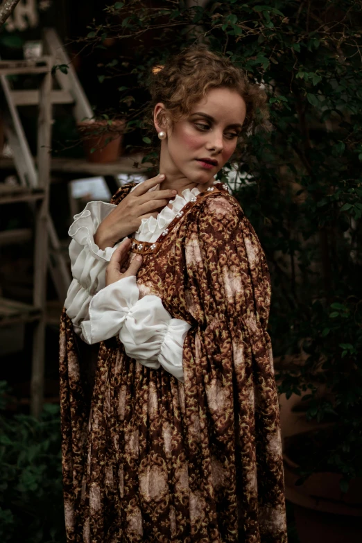 a woman in a brown and white dress holding a baby, inspired by Thomas Stothard, unsplash, renaissance, samara weaving, outdoor photo, ((portrait)), victorian inspired clothing