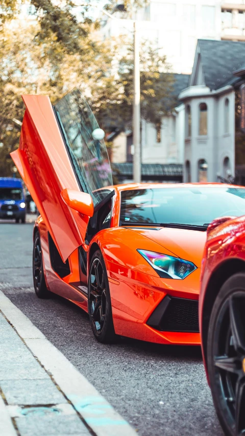 a red sports car parked on the side of the road, by Niko Henrichon, pexels contest winner, pink lamborghini aventador, square, black and orange, 15081959 21121991 01012000 4k