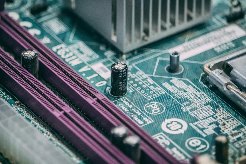 a close up of a computer mother board, by Carey Morris, pexels, instagram post, manufacturing, in front of a computer, emerald
