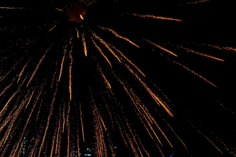 fireworks in the night sky with a city in the background, hurufiyya, 3/4 view from below, pyroclastic flow, bokeh”, 33mm photo