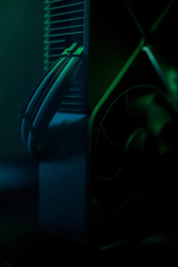 a close up of a fan on a computer, a computer rendering, by Adam Marczyński, unsplash, dark blue and green tones, gaming pc case, ultrawide cinematic 3d render, liquid cooling