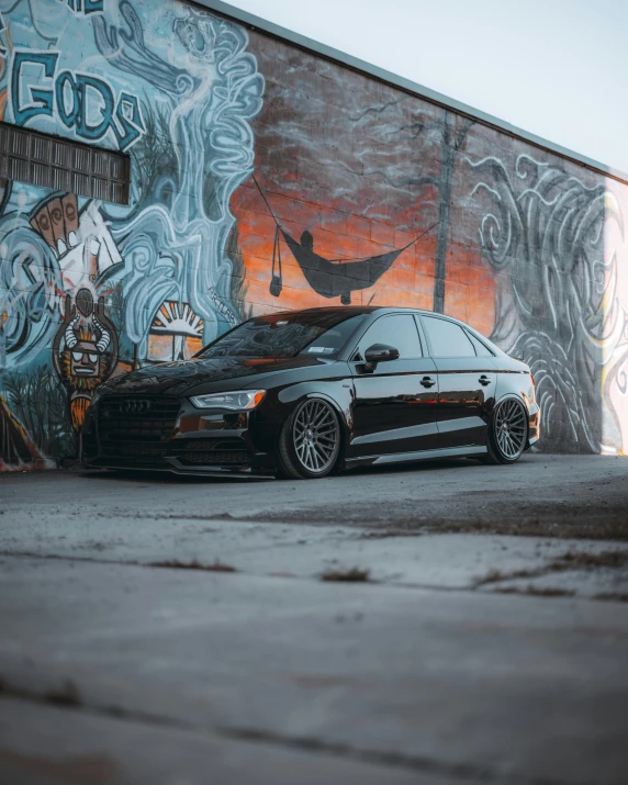 a car parked in front of a graffiti covered wall, pexels contest winner, all black matte product, 5 0 0 px models, audiophile, profile image