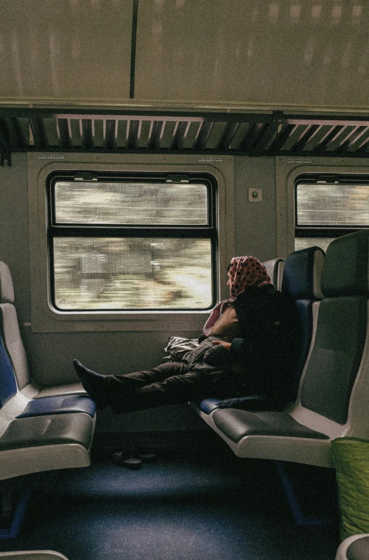 a man sitting on a train looking out the window, by Lucia Peka, pexels contest winner, renaissance, reclining, panoramic view of girl, 🚿🗝📝, pittsburgh