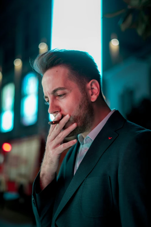 a man in a suit smoking a cigarette, by Julia Pishtar, charlie day, professional profile photo, twitch streamer / gamer ludwig, street photo