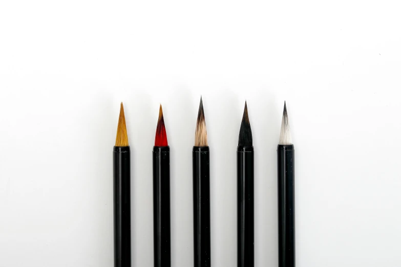 a group of three pencils sitting next to each other, a minimalist painting, inspired by Inshō Dōmoto, pexels, red black white golden colors, extremely detailed brush, on white background, black watercolour