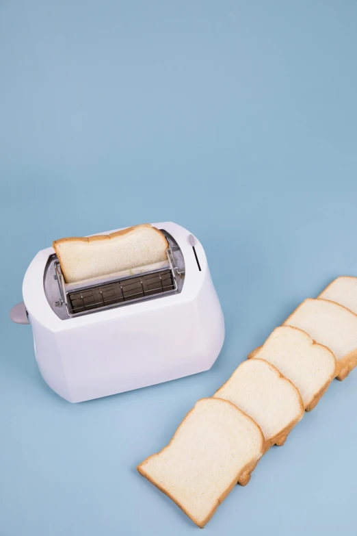 a toaster and slices of bread on a blue background, by Julia Pishtar, unsplash, white plastic, ( ultra realistic, on white, 王琛