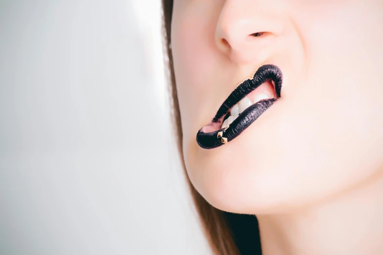 a close up of a person with a tooth brush in their mouth, an album cover, inspired by Hedi Xandt, trending on pexels, aestheticism, dark lipstick, drooling ferrofluid, leather jewelry, about to consume you