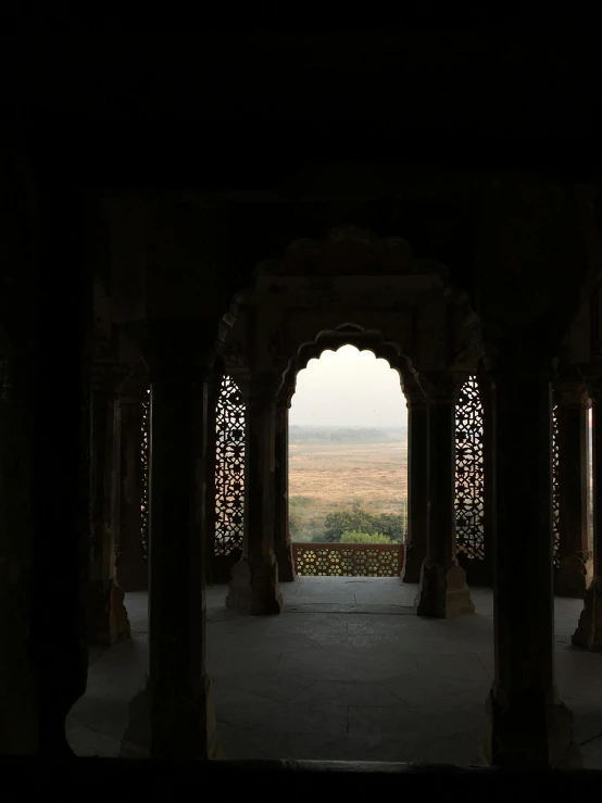 a view of the desert from inside a building, inspired by Steve McCurry, unsplash contest winner, taj mahal, indore, inside the sepulchre, -